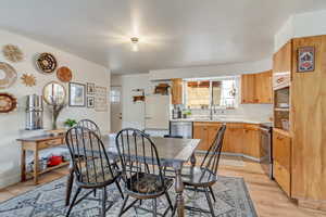 Dining room featuring baseboards and light wood finished floors