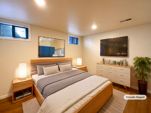 Bedroom with baseboards, visible vents, wood finished floors, and recessed lighting