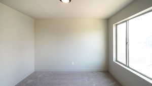 Unfurnished room with carpet floors and baseboards