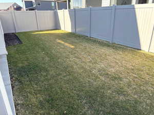 View of yard featuring a fenced backyard