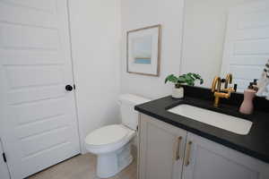 Half bath with toilet and vanity
