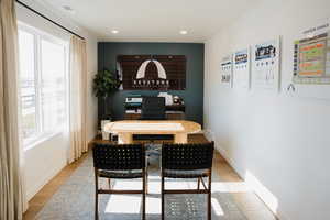 Dining space featuring light wood-type flooring, visible vents, and baseboards