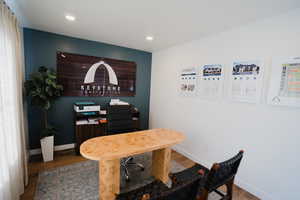 Office featuring baseboards, wood finished floors, and recessed lighting