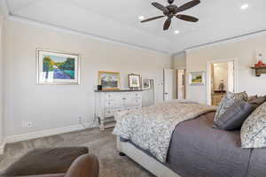 Bedroom with carpet floors, crown molding, recessed lighting, ensuite bathroom, and baseboards