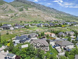Birds eye view of property featuring a residential view and a mountain view