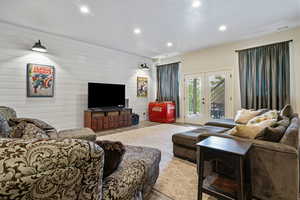 Living area with french doors, visible vents, and recessed lighting