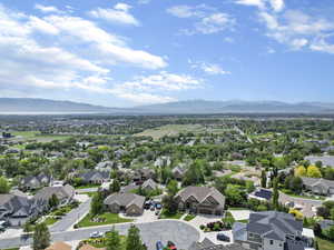 Drone / aerial view with a residential view and a mountain view