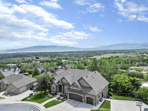 Birds eye view of property with a residential view and a mountain view