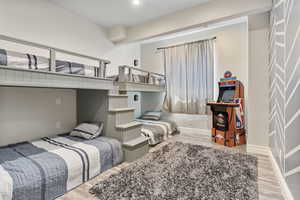 Bedroom featuring recessed lighting, baseboards, and wood finished floors