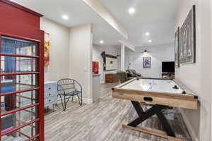 Playroom with baseboards, wood finished floors, and recessed lighting