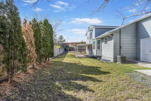 View of yard with fence private yard and cooling unit