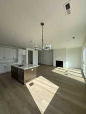 Greatroom with fireplace and large sliding glass door.