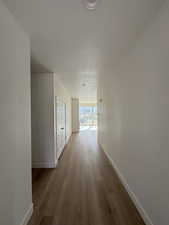 Hallway with wood finished floors