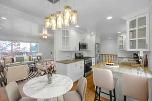 Dining area featuring recessed lighting and light wood-style flooring