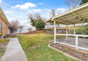 View of yard featuring a patio and a fenced backyard