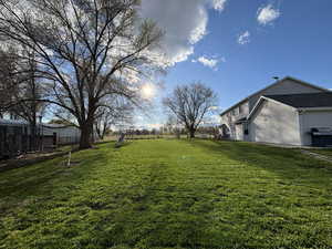 View of yard with fence