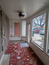 Sunroom / solarium featuring a healthy amount of sunlight