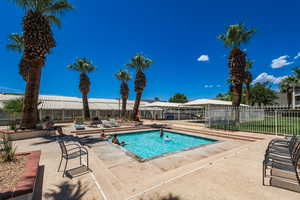 View of pool featuring fence and a patio