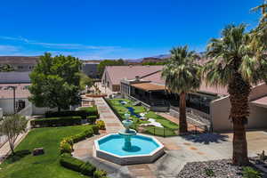 View of pool featuring a yard, fence, and a mountain view