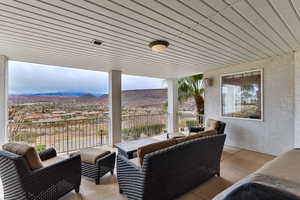 View of patio featuring a mountain view and a balcony