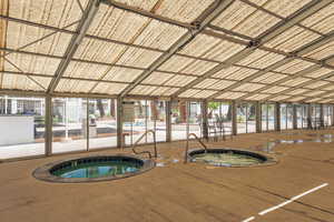 View of swimming pool featuring an indoor in ground hot tub