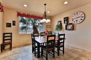 Dining room featuring recessed lighting and baseboards