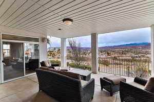 View of patio featuring a balcony and outdoor lounge area
