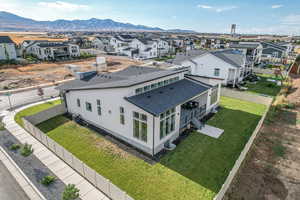 Drone / aerial view featuring a residential view and a mountain view