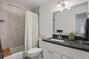 2nd level full bathroom with granite countertops.