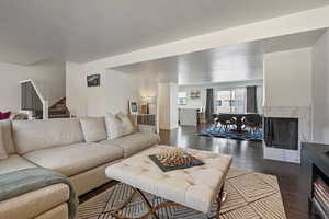 Living room opens up to a dining area and kitchen.