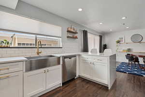 Kitchen windows open out to a private patio courtyard.