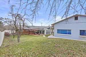 View of yard featuring a patio area, a fenced backyard, and a pergola