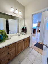 Full Bathroom with vanity and tile patterned floors