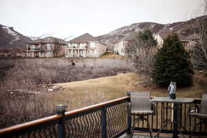 Deck featuring a residential view and a mountain view to the East