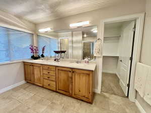 Primary Bathroom featuring a double vanity