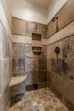 Primary Bathroom with walk in tiled shower