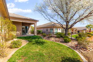 View of yard featuring a patio and fence