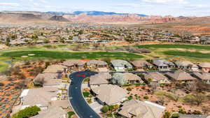 Bird's eye view featuring a residential view, a mountain view, and golf course view