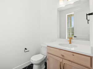 Bathroom featuring vanity and tile patterned floors