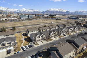 Birds eye view of property with a residential view and a mountain view