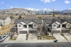 Drone / aerial view with a residential view and a mountain view