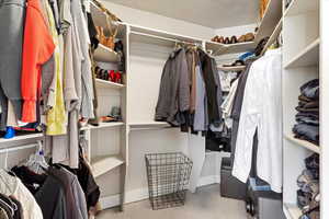 Walk in closet featuring carpet flooring