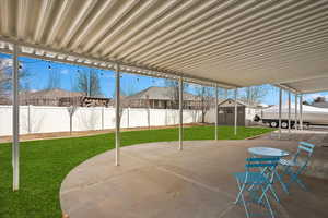 View of patio / terrace with a storage unit, an outdoor structure, and a fenced backyard