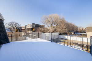 View of yard featuring a residential view and fence