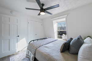 Bedroom with a closet, a ceiling fan, and wood finished floors