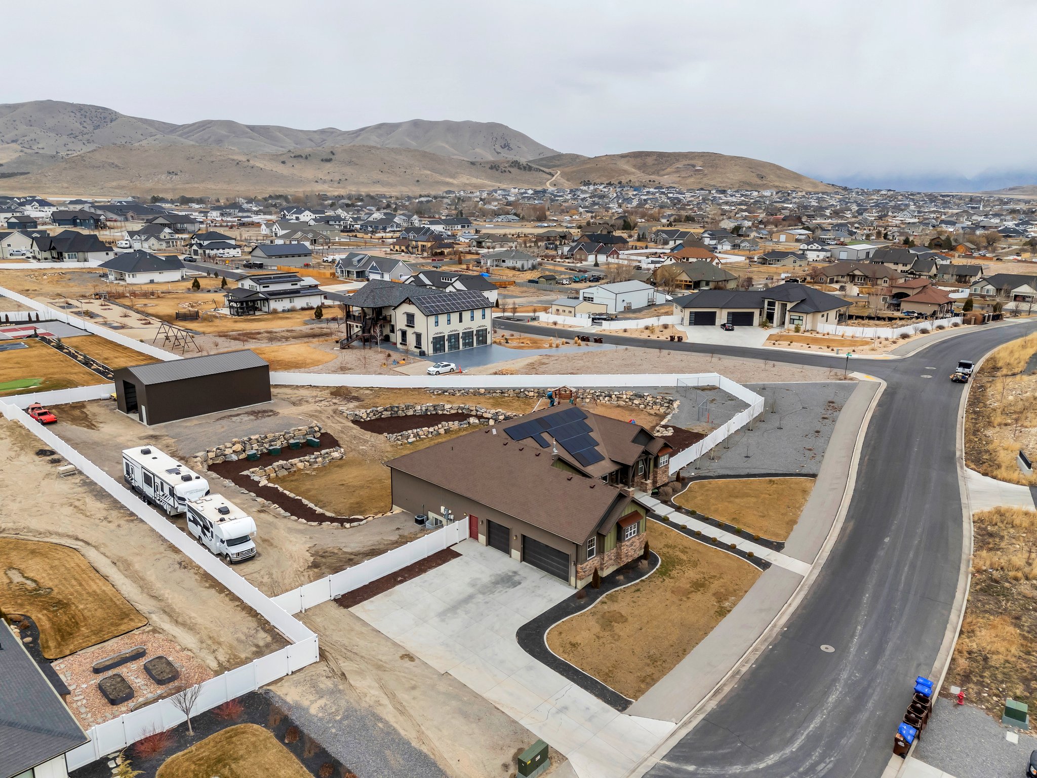 Drone / aerial view featuring a mountain view and a residential view