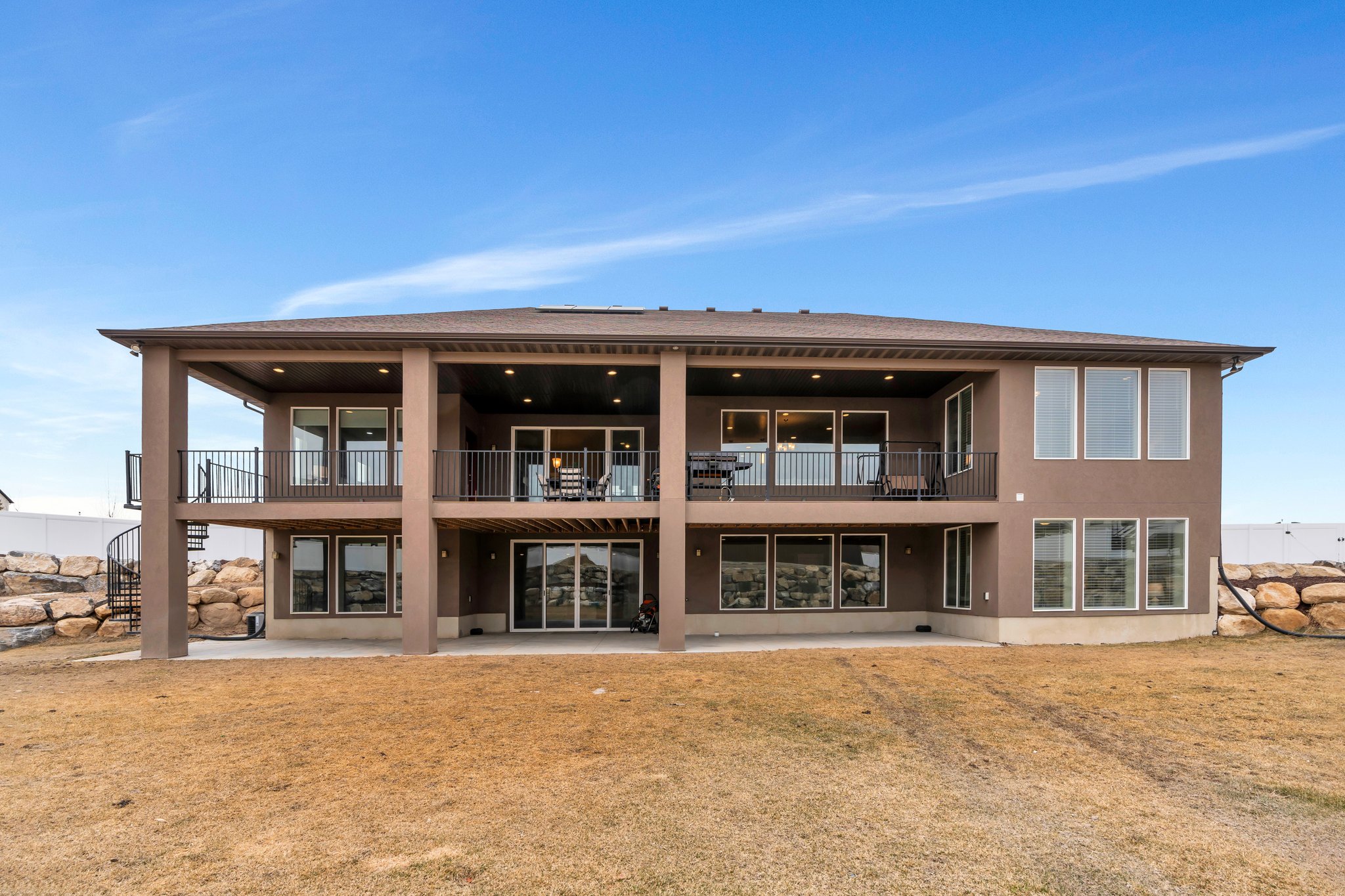 Back of house featuring a patio and stucco siding