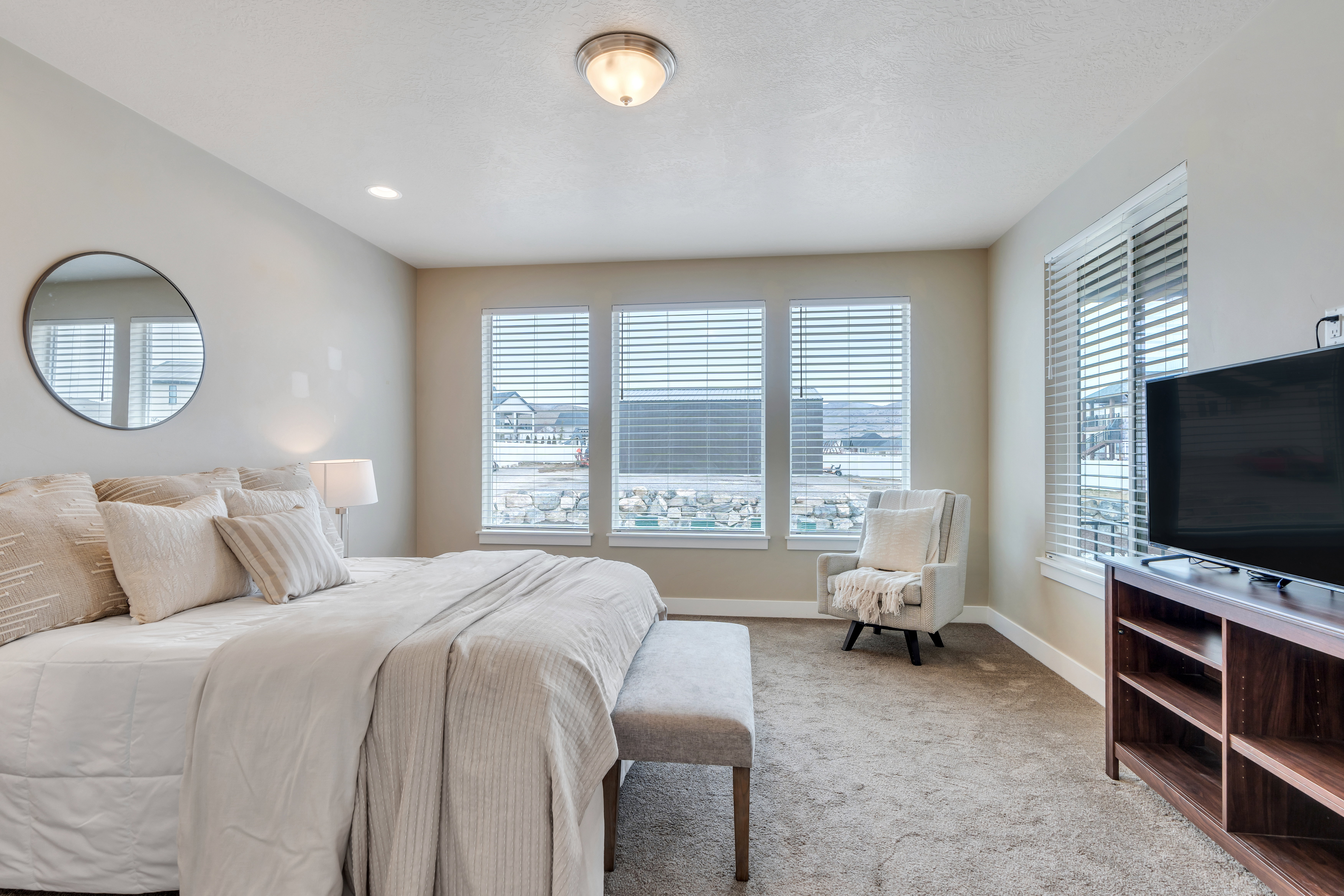 Bedroom featuring carpet floors and baseboards