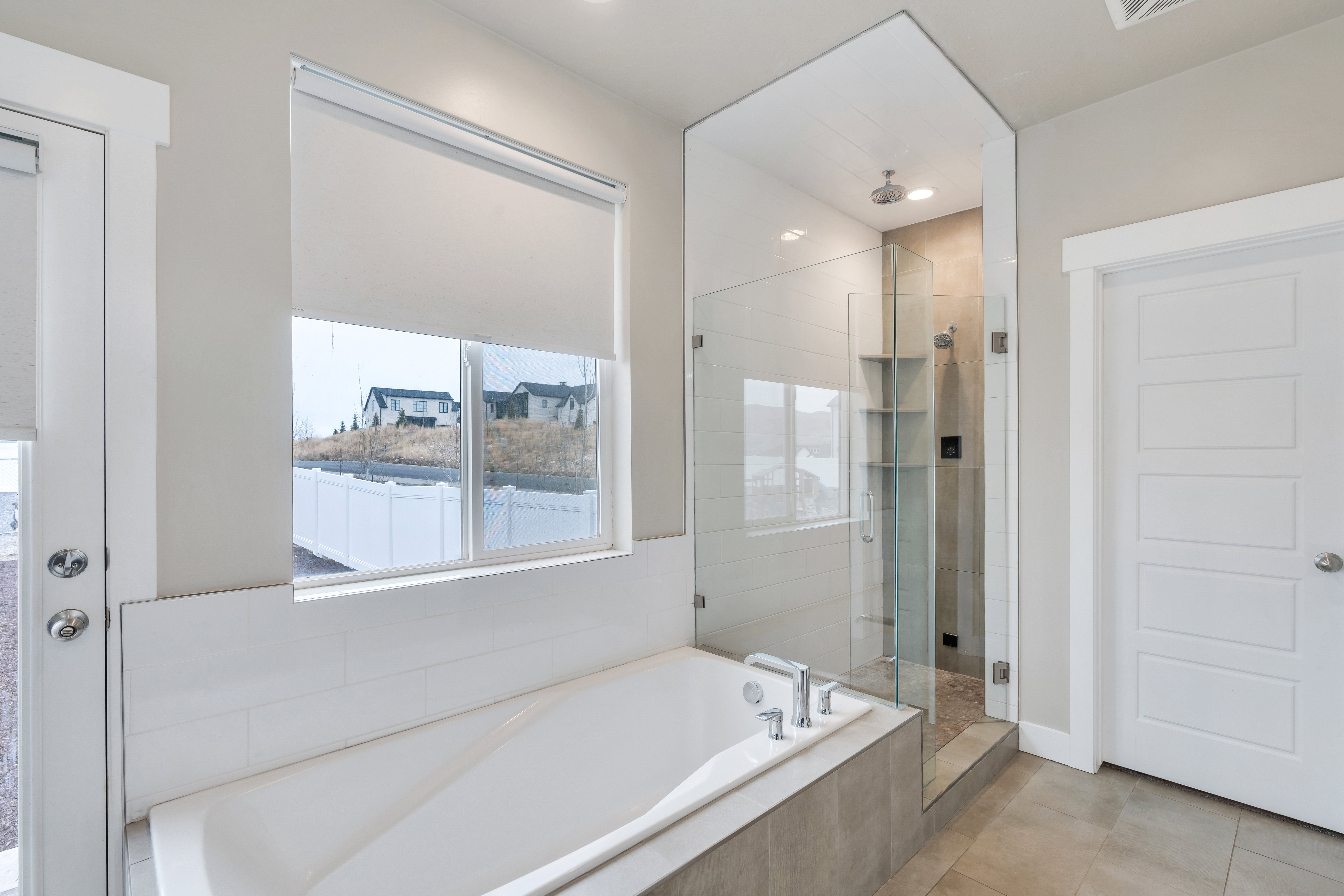 Bathroom with a stall shower, a bath, and tile patterned floors