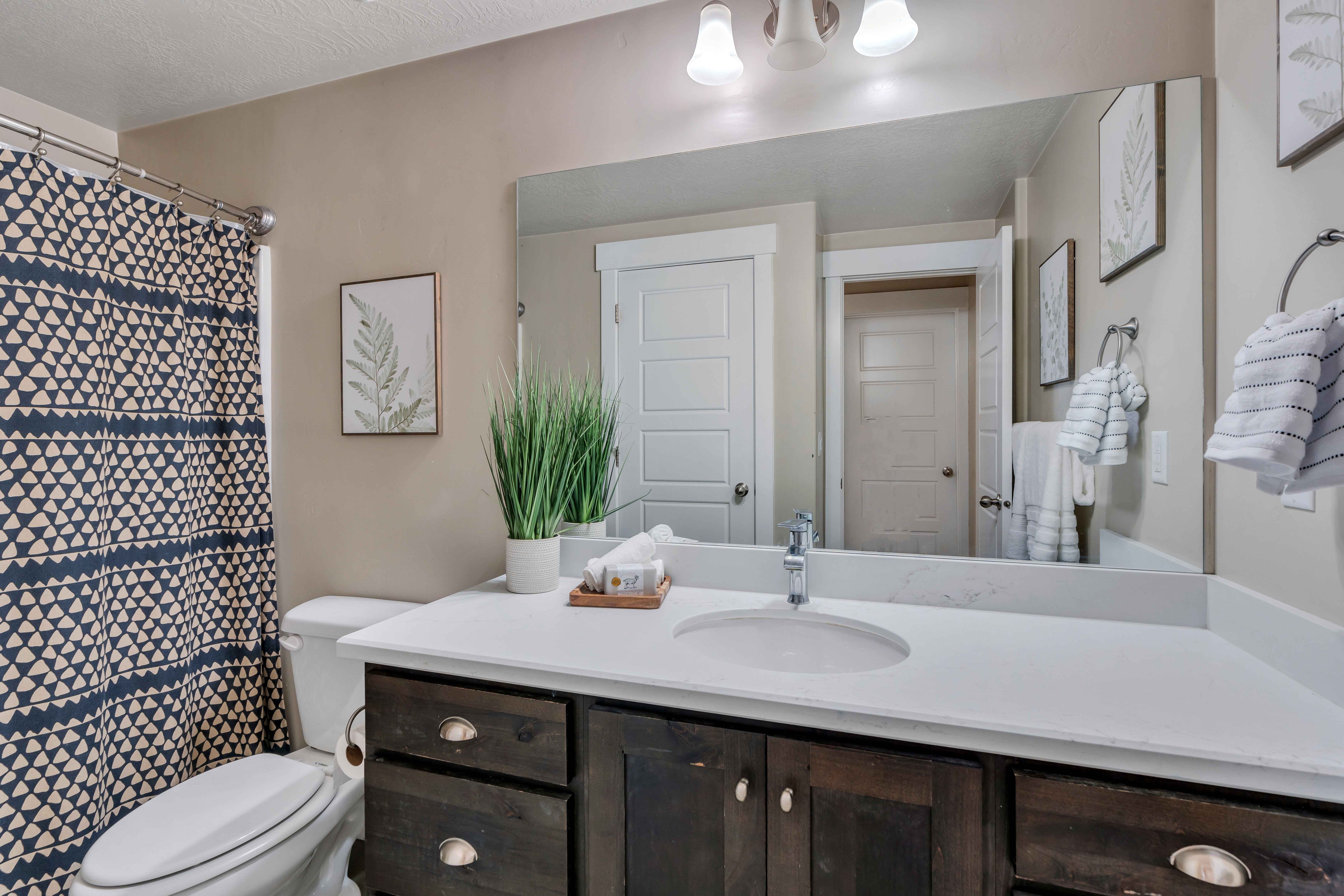 Full bath featuring vanity and toilet